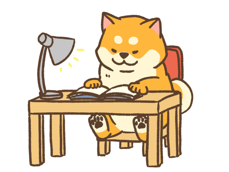 机に向かう柴犬